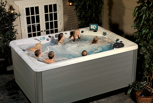 swim spa with an ipad mount on and outdoor patio